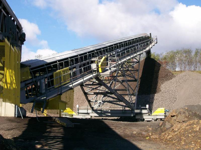 Screen Station Buildings and Screen Feed&Discharge Conveyors Steel Structures: 48 X 100 Radial Stacker; wrap drive with lever-arm gravity take-up 
