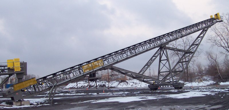 Screen Station Buildings and Screen Feed&Discharge Conveyors Steel Structures: 36 x 150 Radial Stacker; wrap drive with lever-arm gravity take-up roll-away oversize chute 