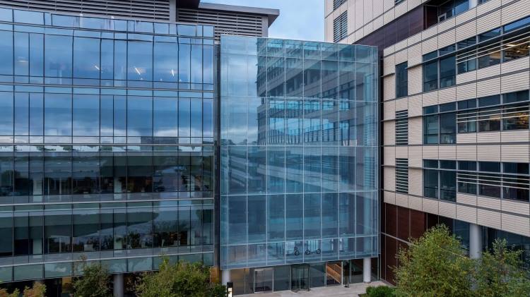 Glass and Steel Atrium Walls with Steel Bow Trusses | Architecturally Exposed Steel